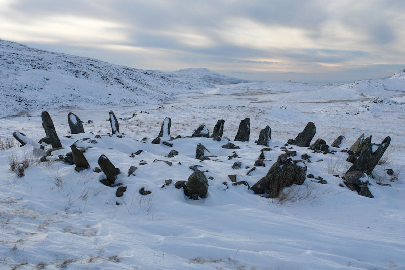 Bryn Cader Faner standing in snow among the Rhinogydd hills