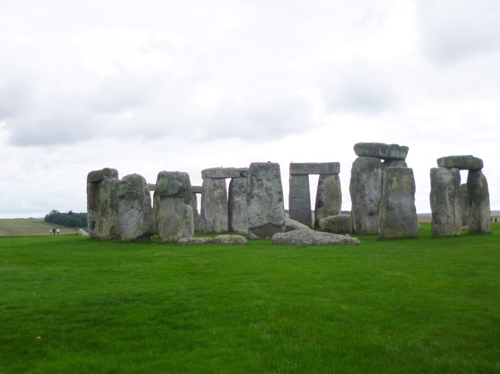 Stonehenge's standing sarsens and lintels seen across the grass