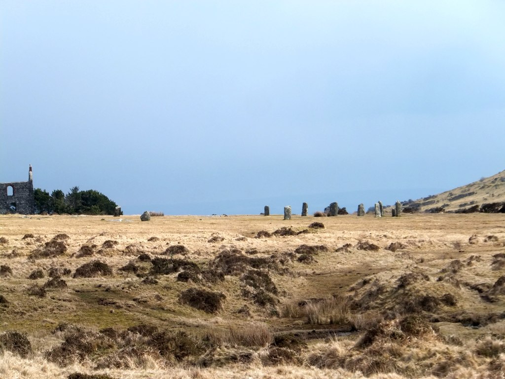 The Hurlers seen at a distance across rough moorland